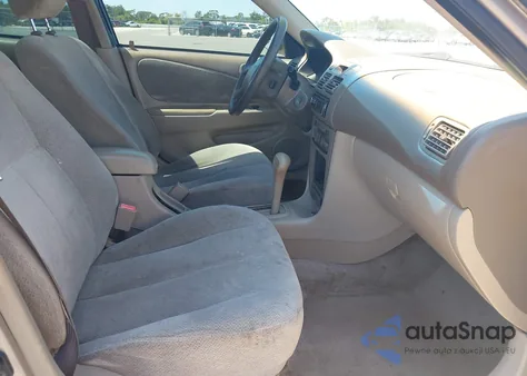 2001 Toyota Corolla Le z USA, uszkodzony, nr VIN 2T1BR12E01C396970